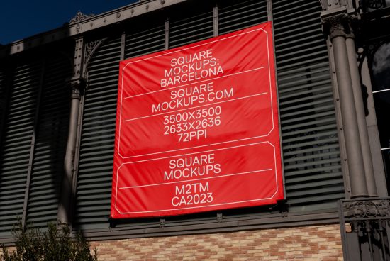 Red billboard mockup hanging on a building facade under bright sunlight featuring high resolution dimensions for graphic designers.